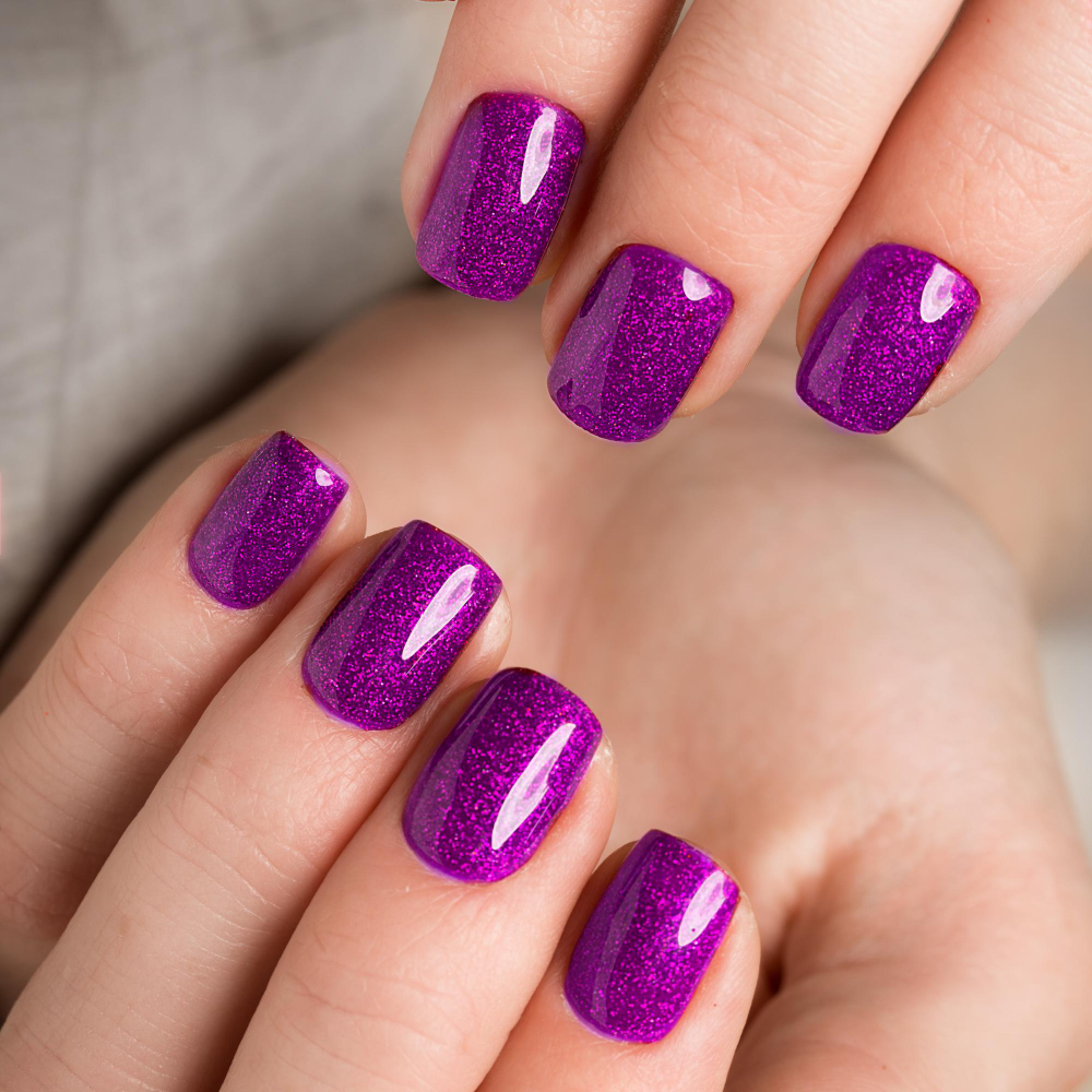 bright-festive-purple-manicure-female-hands-nails-design
